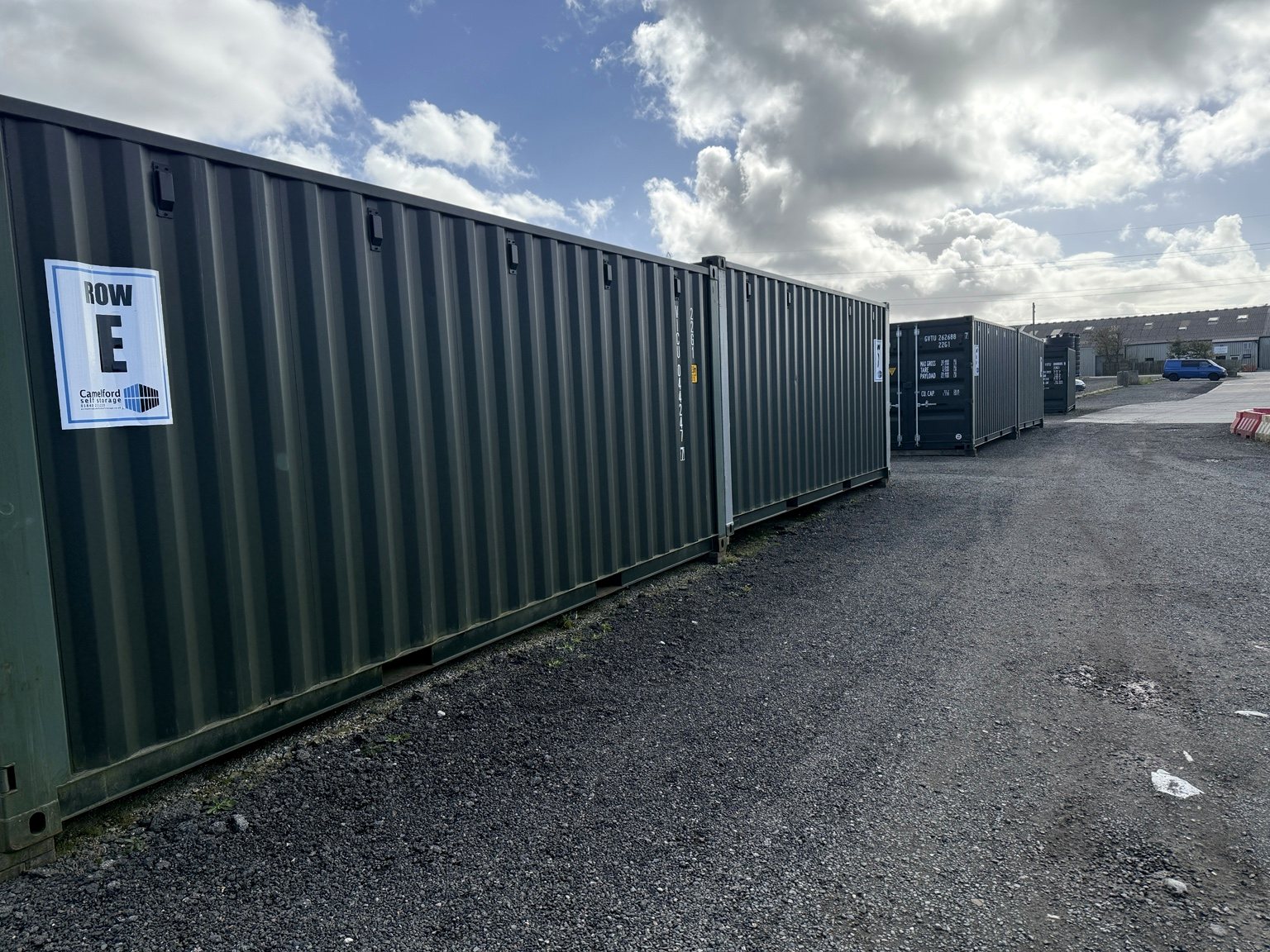 A view along a row of storage containers at Camelford Self Storage